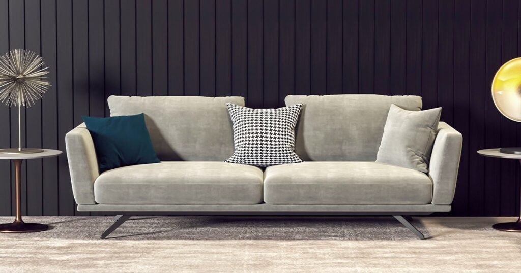 A modern living room featuring a stylish couch and a contemporary lamp, inviting and well-lit for relaxation.