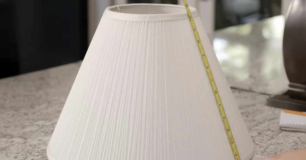 Measuring tape along slant height of lampshade